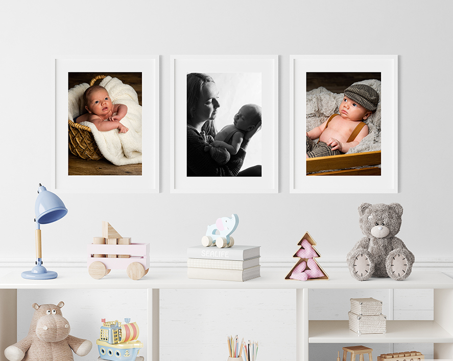 Baby nursery with newborn photography portraits in frames